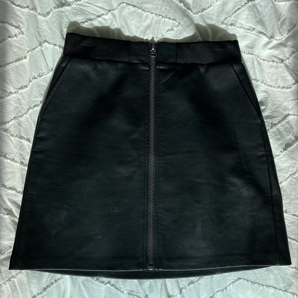 Black faux leather skirt with front zipper detail